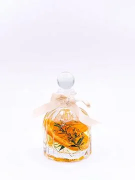 Reed diffuser with cinnamon and orange on white background Stock Photos