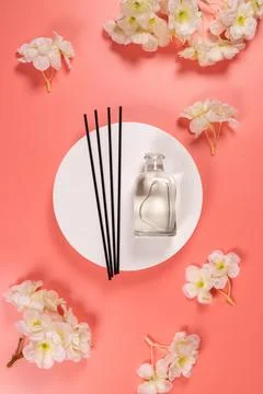 Reed diffuser with essential oil and white flowers Stock Photos