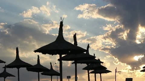 Reed umbrella on the beach on sunset Video stock 12274232