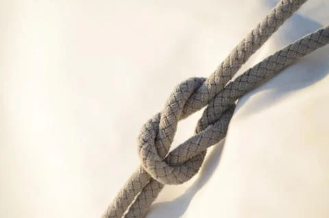 Reef knot or square knot, it was used by sailors for reefing sails Stock Photos