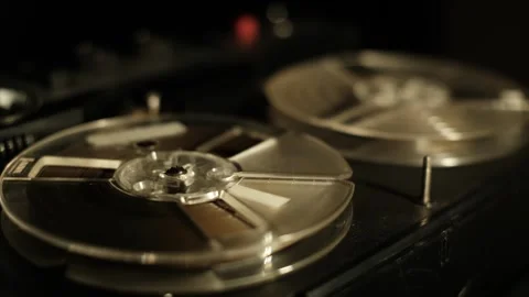 Reel-to-reel tape player, hand starting the tape, closeup Stock Footage 301542467
