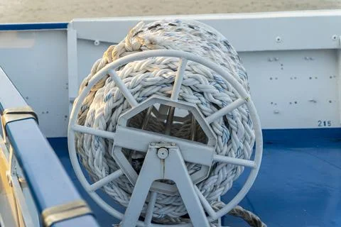 Reel with a strong ship rope on the deck of the ship Photos