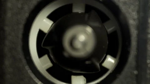 Reel of a vintage audio cassette macro rotating in the tape recorder Stock Footage