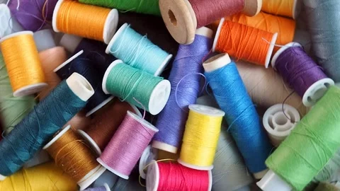 Reels with colored threads for sewing and needlework rotate. Subjects for hobby  Stock-Footage 244786727