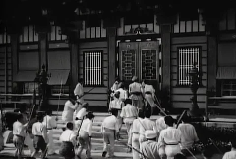 Reenactment of armed villagers sneaking into temple, 1930s Stock-Footage 95348043