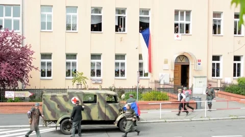 Reenactment performance battle of World War II on the street - ambulance drives Stock Footage 49903341