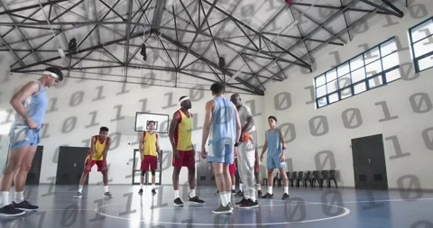 Ref lifting ball and starting animated clock, jumpers vying for tip at center Stockbeeldmateriaal 326184928