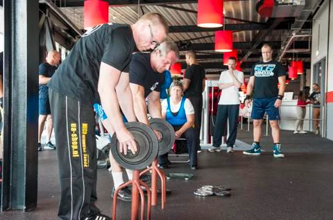 Referee changing weights at championship Stock Photos