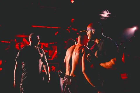 Referee is checking fighter before enters in ring, cage at MMA match Stock Photos