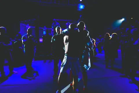 Referee is checking fighter before enters in ring, cage at MMA match Stock Photos