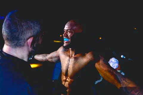 Referee is checking fighter before enters in ring, cage at MMA match Stock Photos