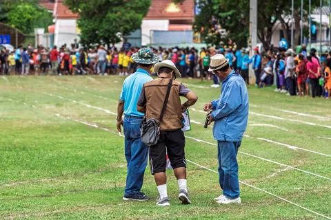 Referee checking starting pistol revolver for sports competition. .Sports o.. Stock Photos