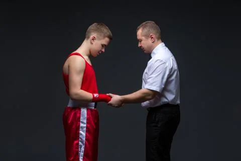 Referee checking young boxer Stock Photos