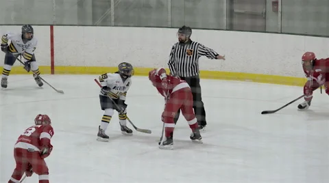 Referee droping puck in a face off during hockey game. 4K UHD. Stock Footage 58721782