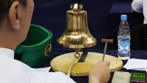 Referee during professional boxers man fight. Judge strikes the Gong Stock Footage 84832879