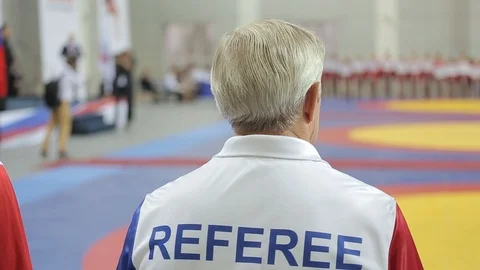 Referee in the gym observes the competition Stock Footage 87027657