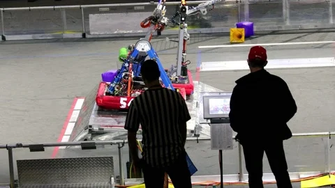 Referee looks on as Robot tips over on t... | Stock Video | Pond5