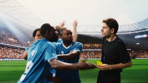 Referee showing red card after second yellow card shown to black player Stock Footage 337995019