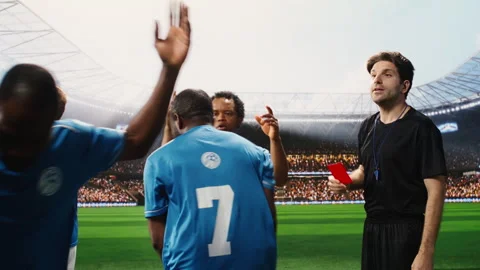 Referee showing second yellow card and eliminating blue team player Stock Footage 337995275