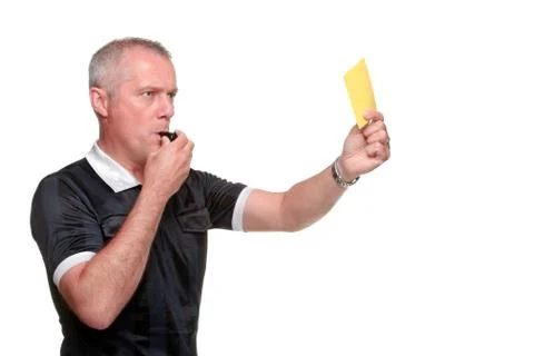 Referee showing the yellow card side profile Stock Photos