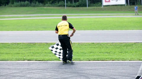 Referee signaling a start of a new go-kart round Stock Footage 33065836