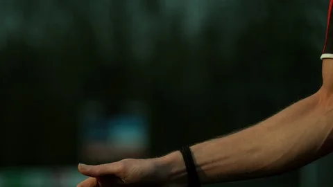 Referee taking his whistle in his hands, Blurred background  4K 1000FPS Video stock 90953971