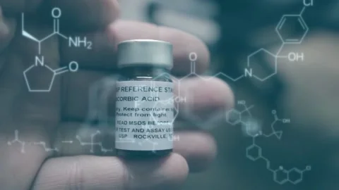 A reference standard from ascorbic acid is hold with chemical structures from ph Stock Footage 216093797