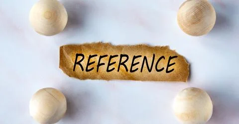 REFERENCE - word on a brown torn piece of paper on a light background with .. Stock Photos