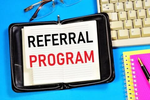 Referral program. Text label in the planning Notepad. Stock Photos