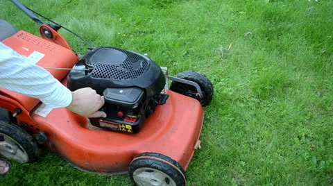 Refill fill grass lawn mower cutter fuel tank Stock Footage 22565749