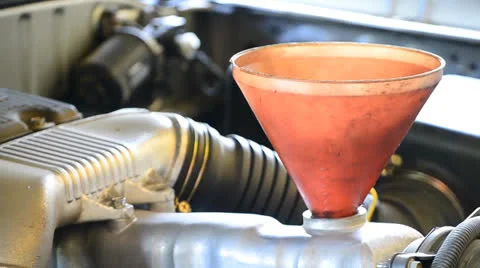 Refill lubricant oil in to engine car Stock Footage 27063051