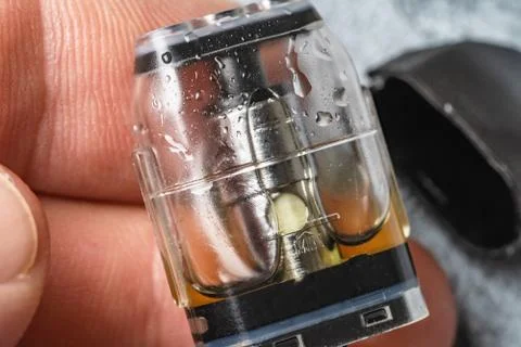 Refillable cartridge for vape pod or vape pen, small electronic cigarette device Stock Photos
