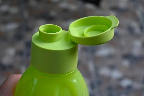 Refillable drinking bottle with flip cap Stock Photos