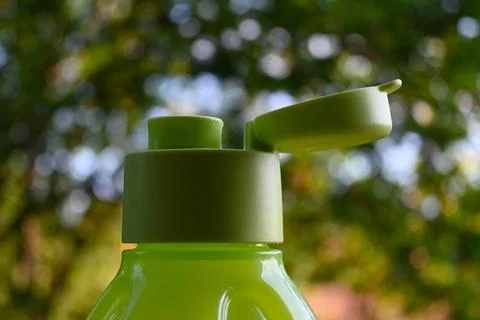 Refillable drinking bottle with flip top Stock Photos