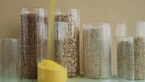 Refillable glass jar with raw grain porridge. Copy space Refill product format Stock Footage 316072513
