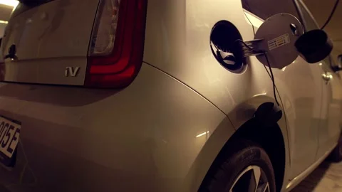 Refilling an electric car - plugin the type 2 cable into the electric car Video stock 156945596