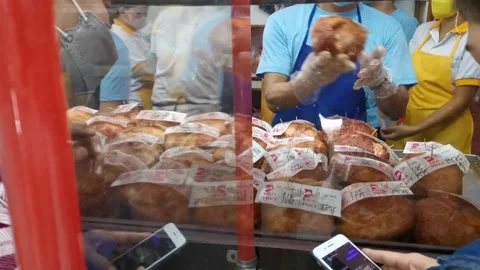 Refilling Empty Cooked Ham Station in Manila Stock Footage 228707662