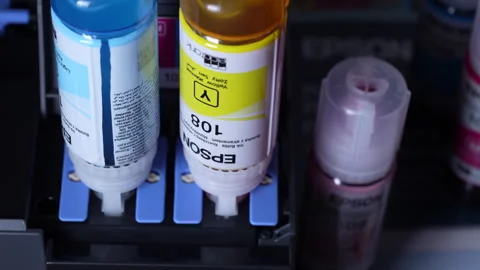 Refilling Epson EcoTank L8050 printer with original ink bottles Stock Footage 333240818