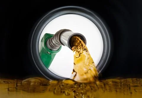 Refilling fuel view from inside of gas tank of a car Stock Photos