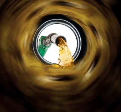 Refilling fuel view from inside of gas tank of a car Stock Photos