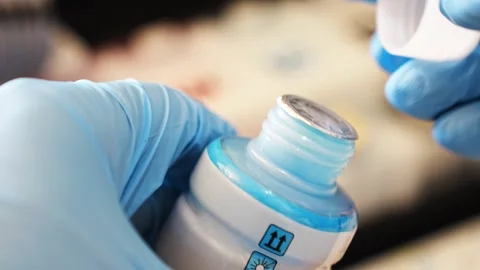 Refilling ink for continuous ink supply system in home office setup Stock Footage 308516351