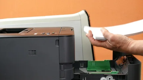 Refilling a laser printer paper tray. Video stock 90709244
