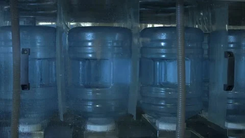 Refilling process of water cooler bottles Stock Footage 144525803