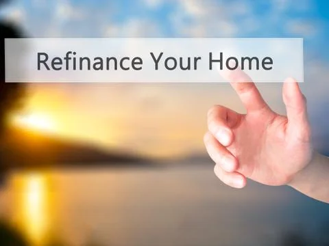 Refinance Your Home  - Hand pressing a button on blurred background concept o Foto stock