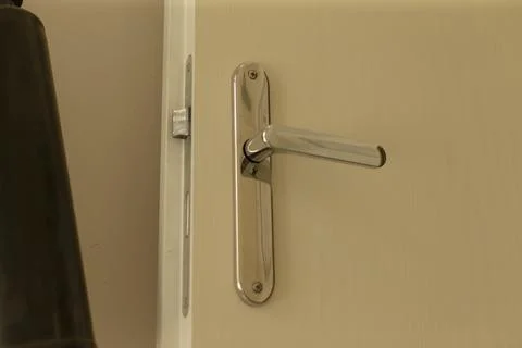Refined chrome door handle with reflection and textured finish Photos
