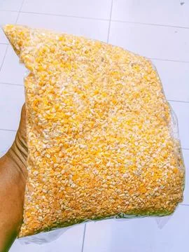 Refined corn in a pack for chicken feed Stock Photos