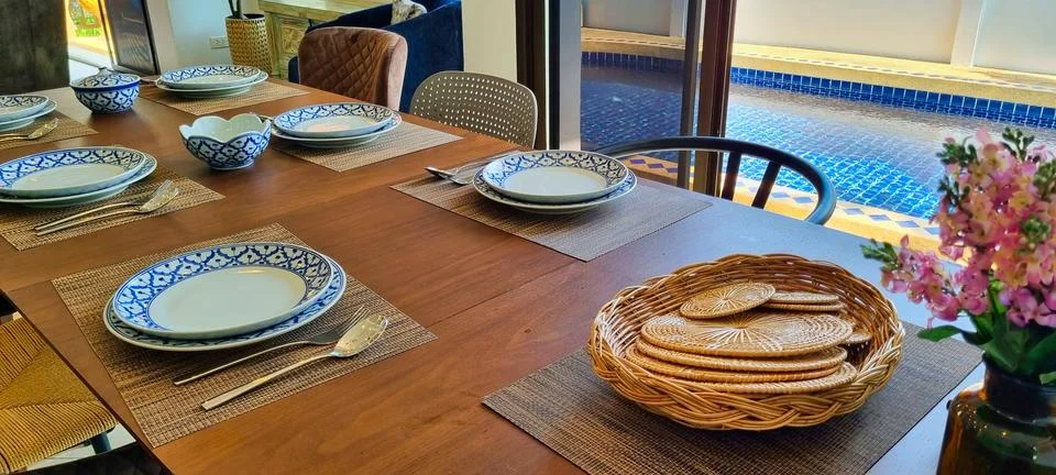 Refined Dining Table Setting with Thai Ceramics by the Pool Stock Photos