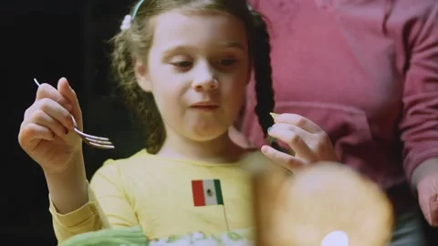 Refined food study of young diner enjoying a spoonful of chili Stock Footage 342153618