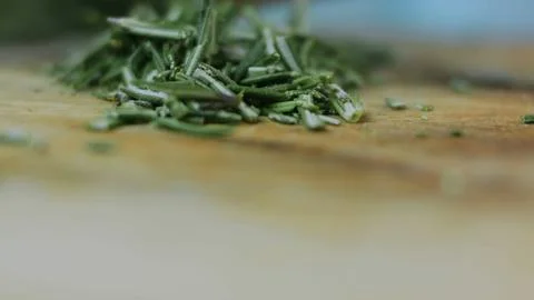 Refined gourmet presentation: adding aromatic herbs to a hot pan 스톡 사진
