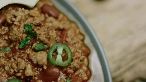 Refined kitchen study of complete chili con carne with rice and avocado Foto stock